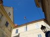 hanging-man-statue-amidst-buildings