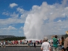yellowstone-old-faithful-erupts-behind-crowd